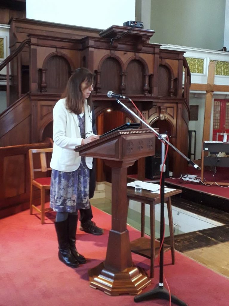 Alina sharing her story before being baptised